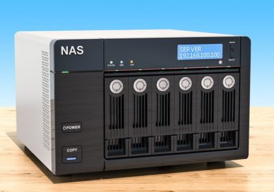 NAS with six disks on the wooden table, 3D rendering